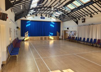 Upton Village Hall main hall photographed from the back of the hall looking towards the stage
